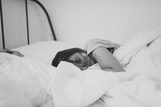 A woman testing a mattress