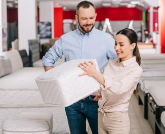 What Is The Normal Thickness Of A Mattress & Boxspring. Couple checking the thickness.