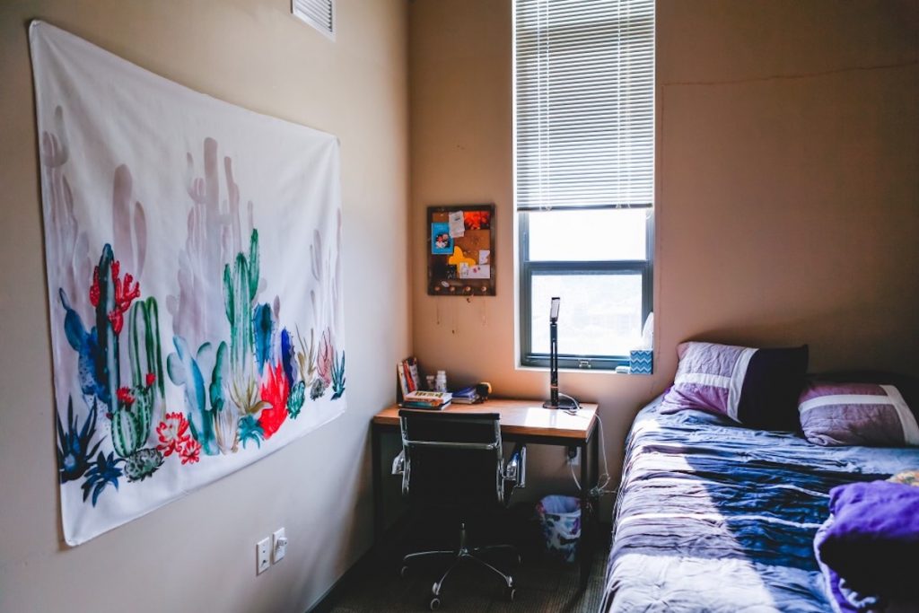 How To Choose The Best Mattress For Your Dorm Room. Bed in a dorm room.