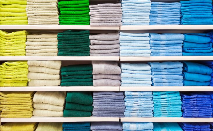 Colorful linen in a linen closet.