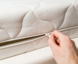 Protecting a mattress with a mattress cover.