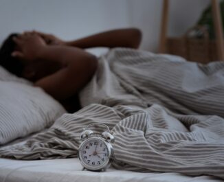 Understanding sleep apnea. Woman struggles to sleep.