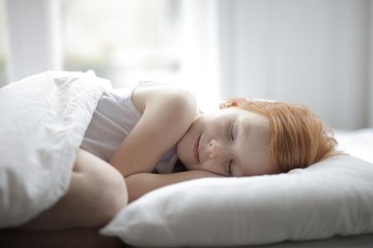 a girl smiling in her sleep. poor sleep habits.